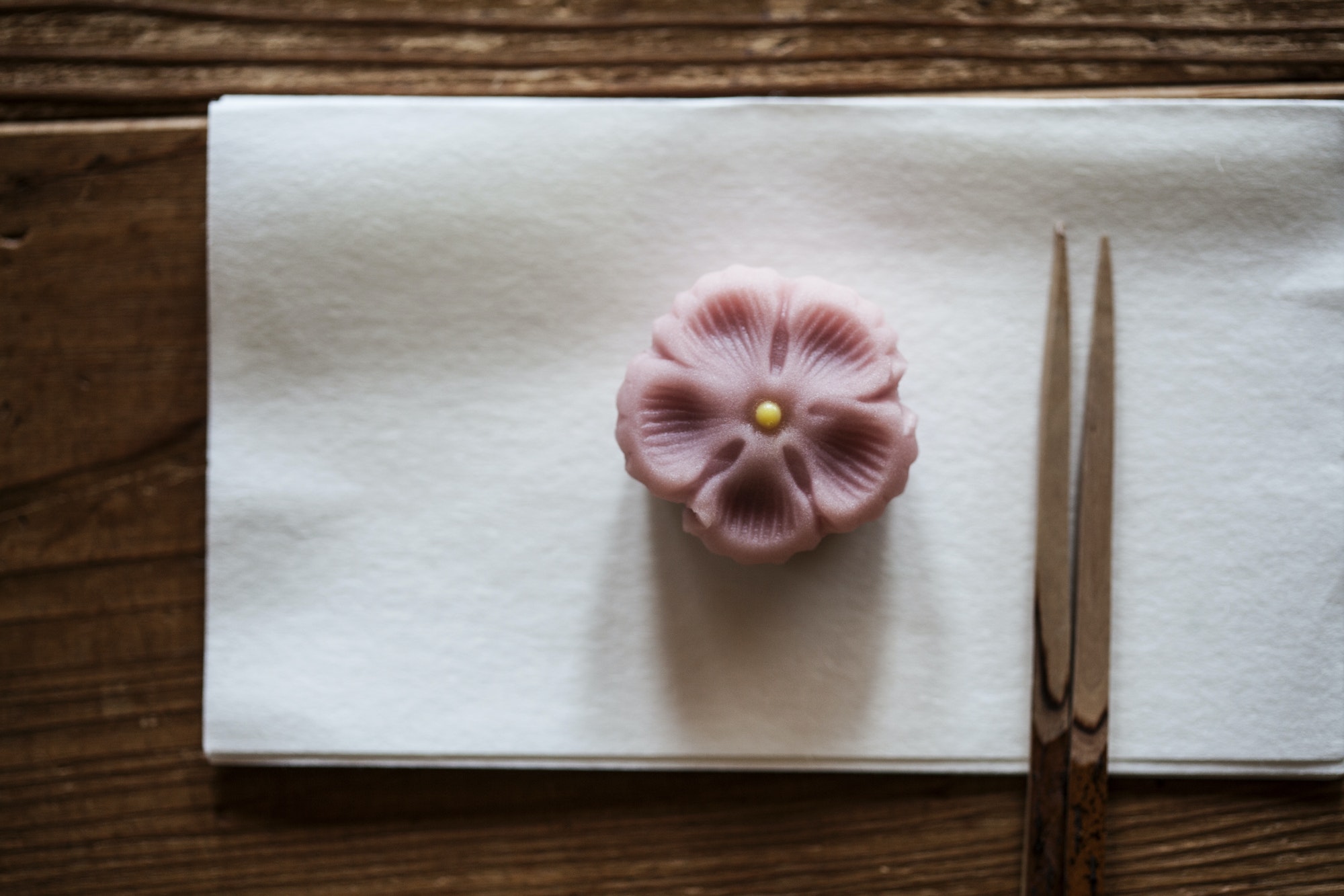 Pair of chopsticks and Wagashi, a sweet served during a Japanese Tea Ceremony.