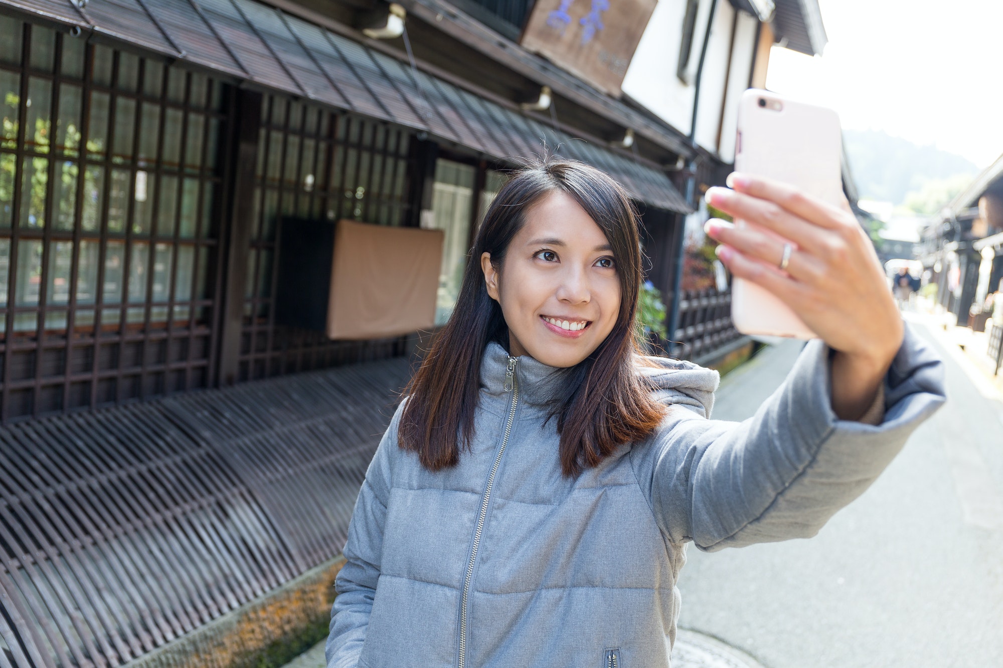 Woman traveler taking selfie in Takayama city